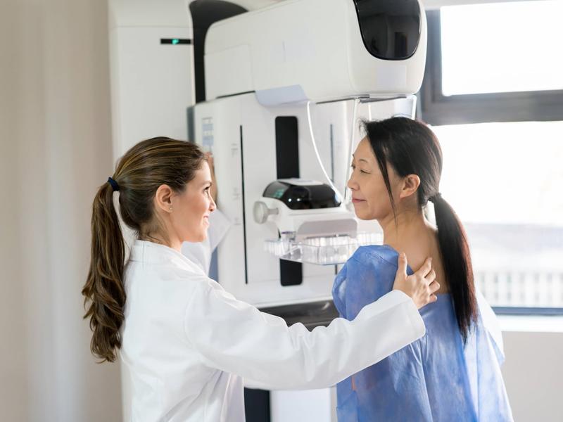 doctor and patient preparing for mammography