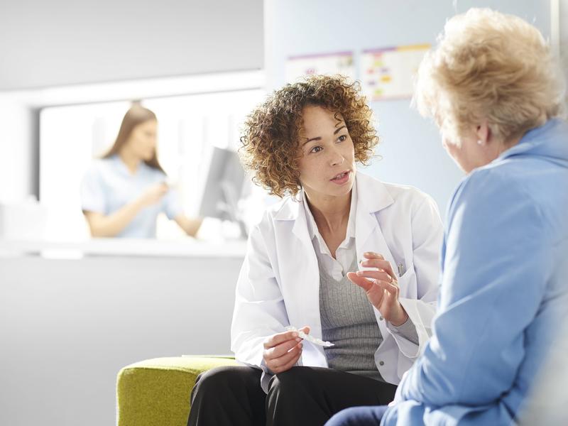 provider speaking with an older female patient