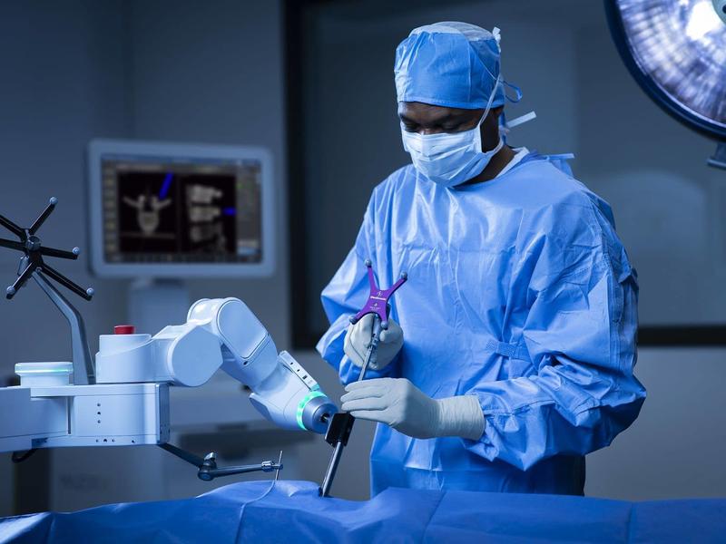 A CAMC Doctor performing a Robotic spine surgery