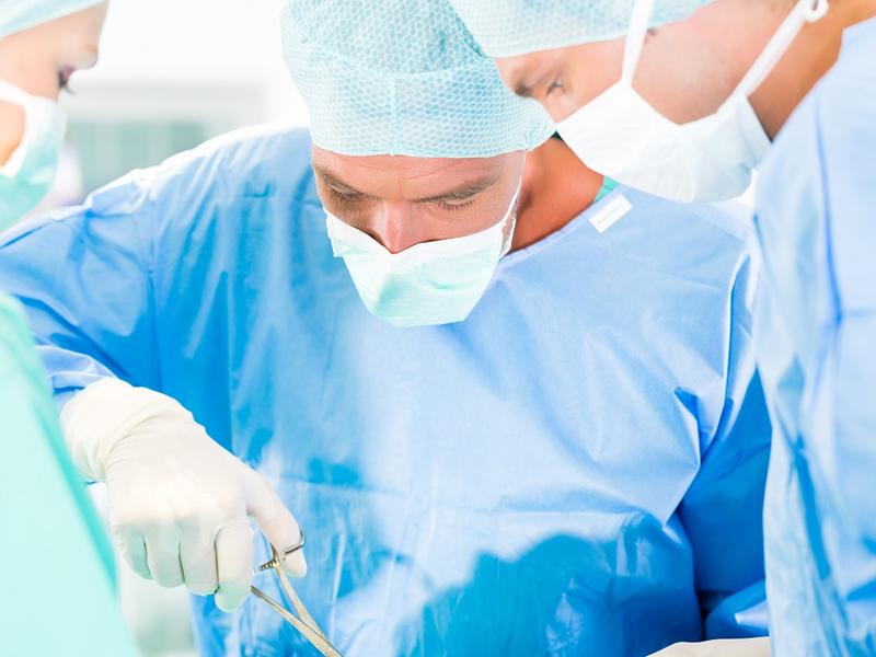 Photo of surgeons in operating room.