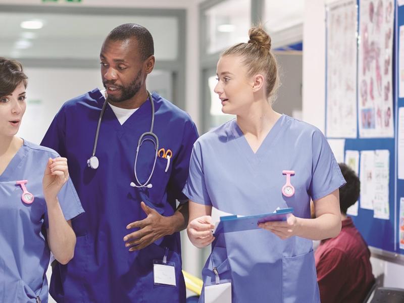 Group of nurses walking in hallway