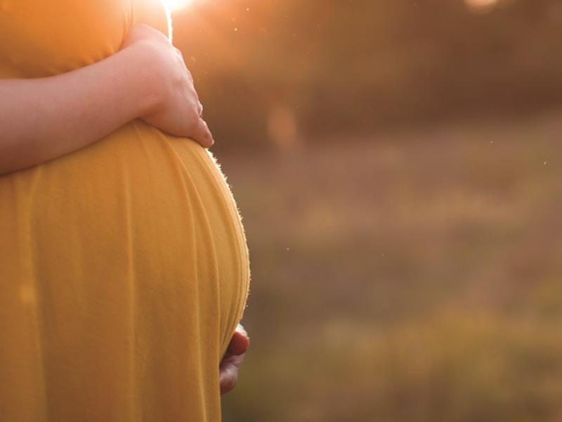 Pregnant woman in field