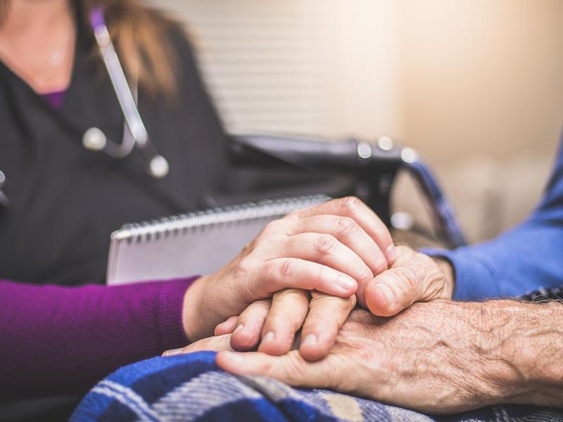 Nurse with patient in wheelchair