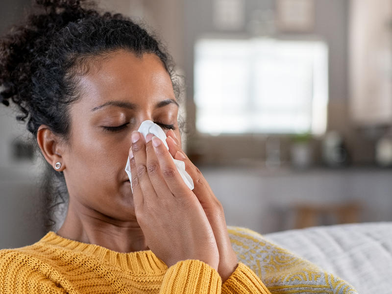 woman suffering from allergy symptoms