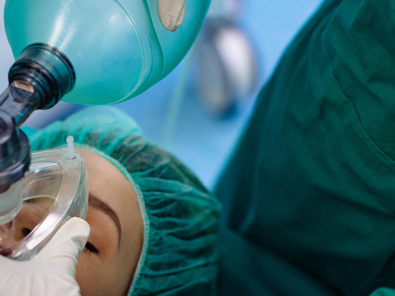 Patient in operating room setting receiving anesthesia