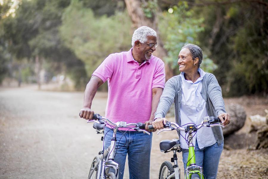 Couple walking with bicycles 