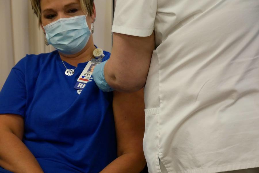 Kelly Harrison receiving vaccine
