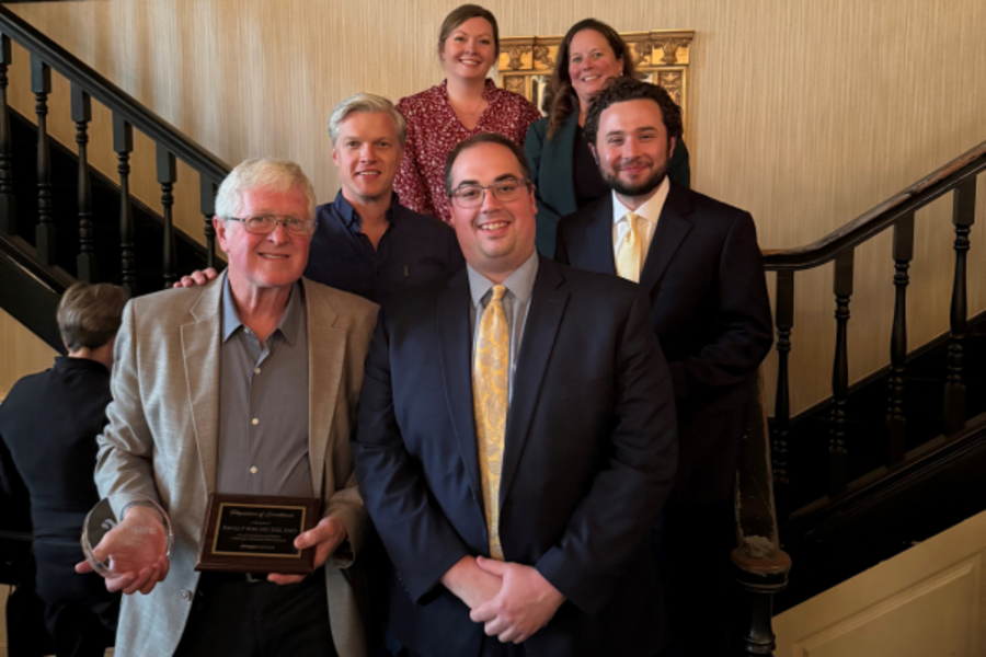 Dr. Wise with team accepting award