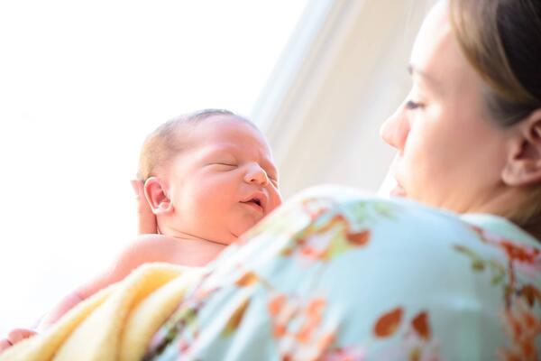 Mother looking at newborn baby