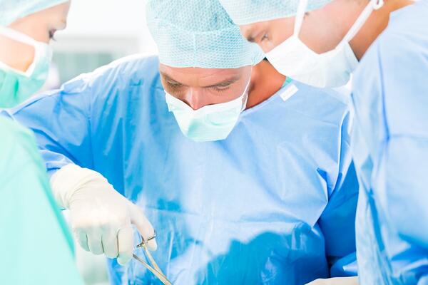 Photo of surgeons in operating room.