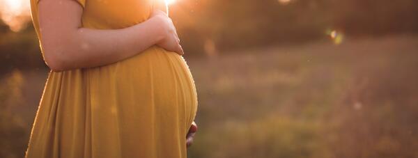 Pregnant woman in field