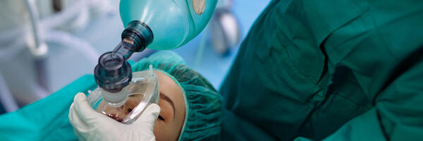 Patient in operating room setting receiving anesthesia