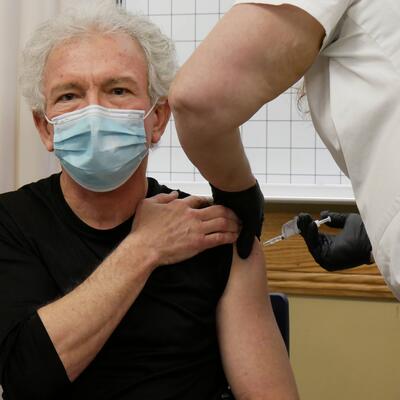 Hospital worker getting COVID vaccine